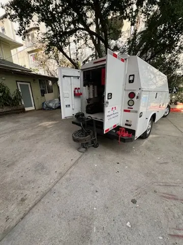 Magnet Plumbing service vehicle on-site for Grease Trap Cleaning in David Estates